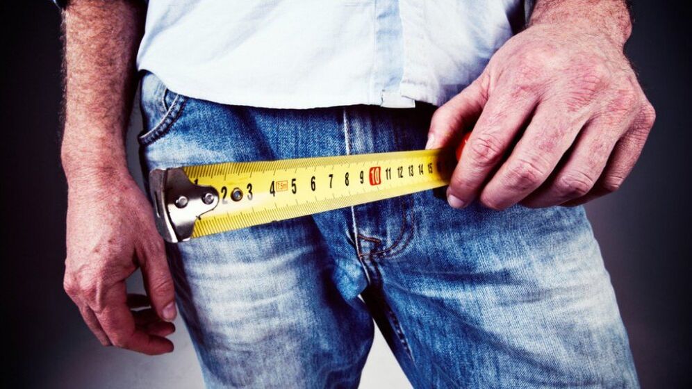 Man measures penis after using gel to enlarge it